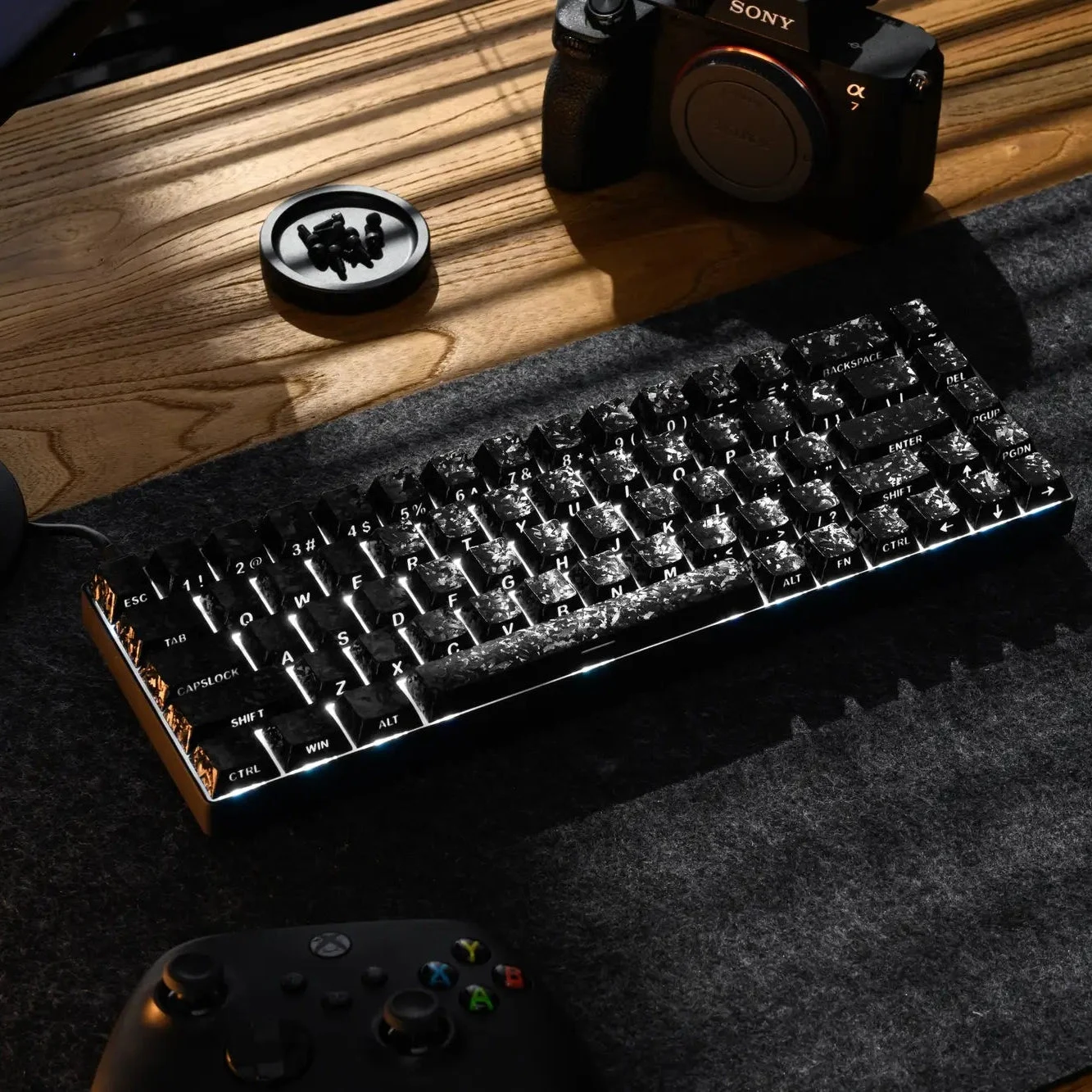 XVX Forged Carbon-Look black shine-through keycaps on a backlit keyboard, legends glowing